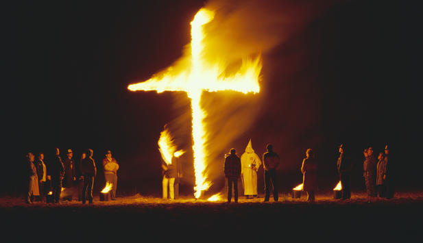 white-supremacists-standing-around-burning-cross.jpg